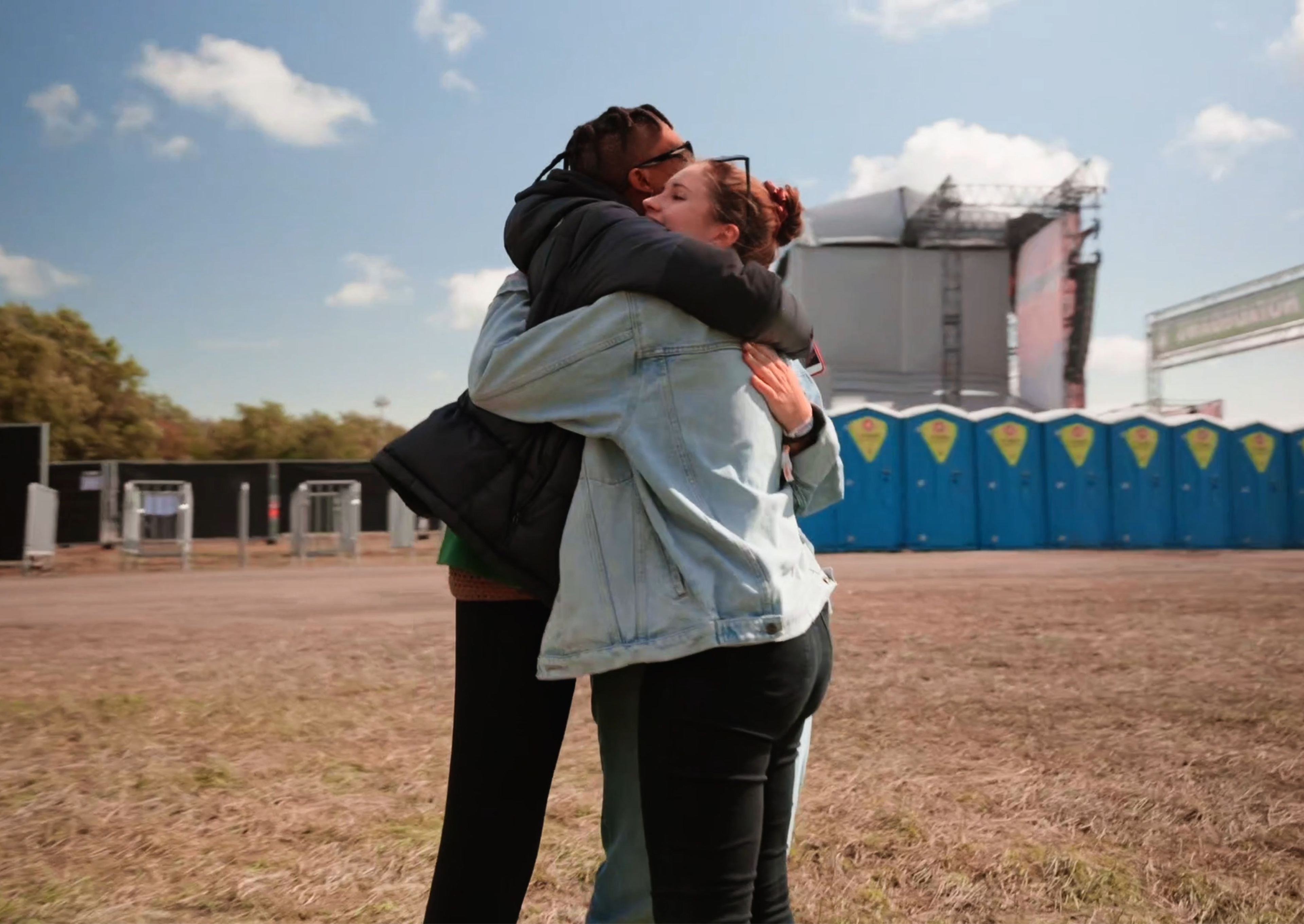 Two people hug at festival