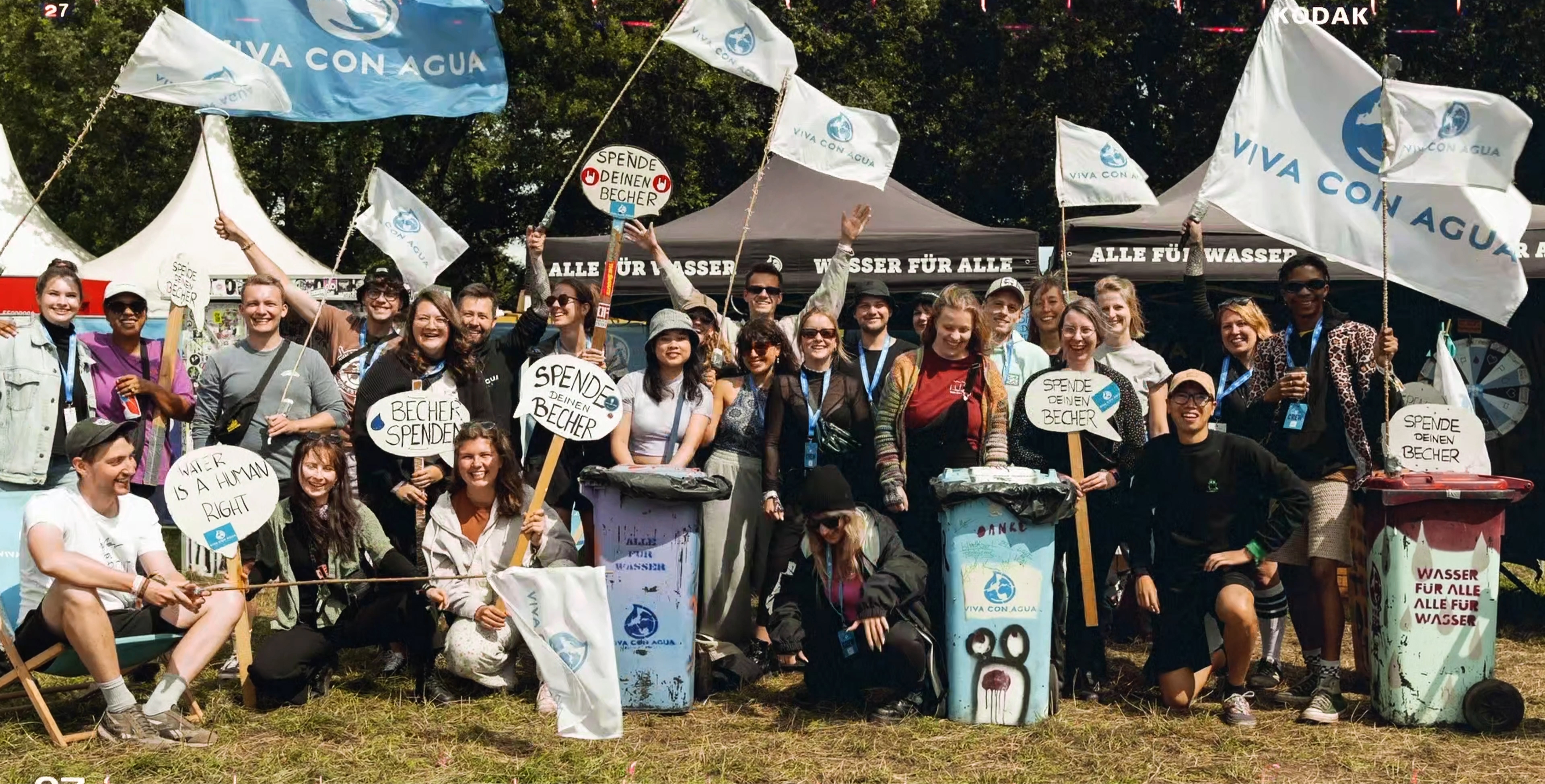 Volunteers collecting plastic cups at festival