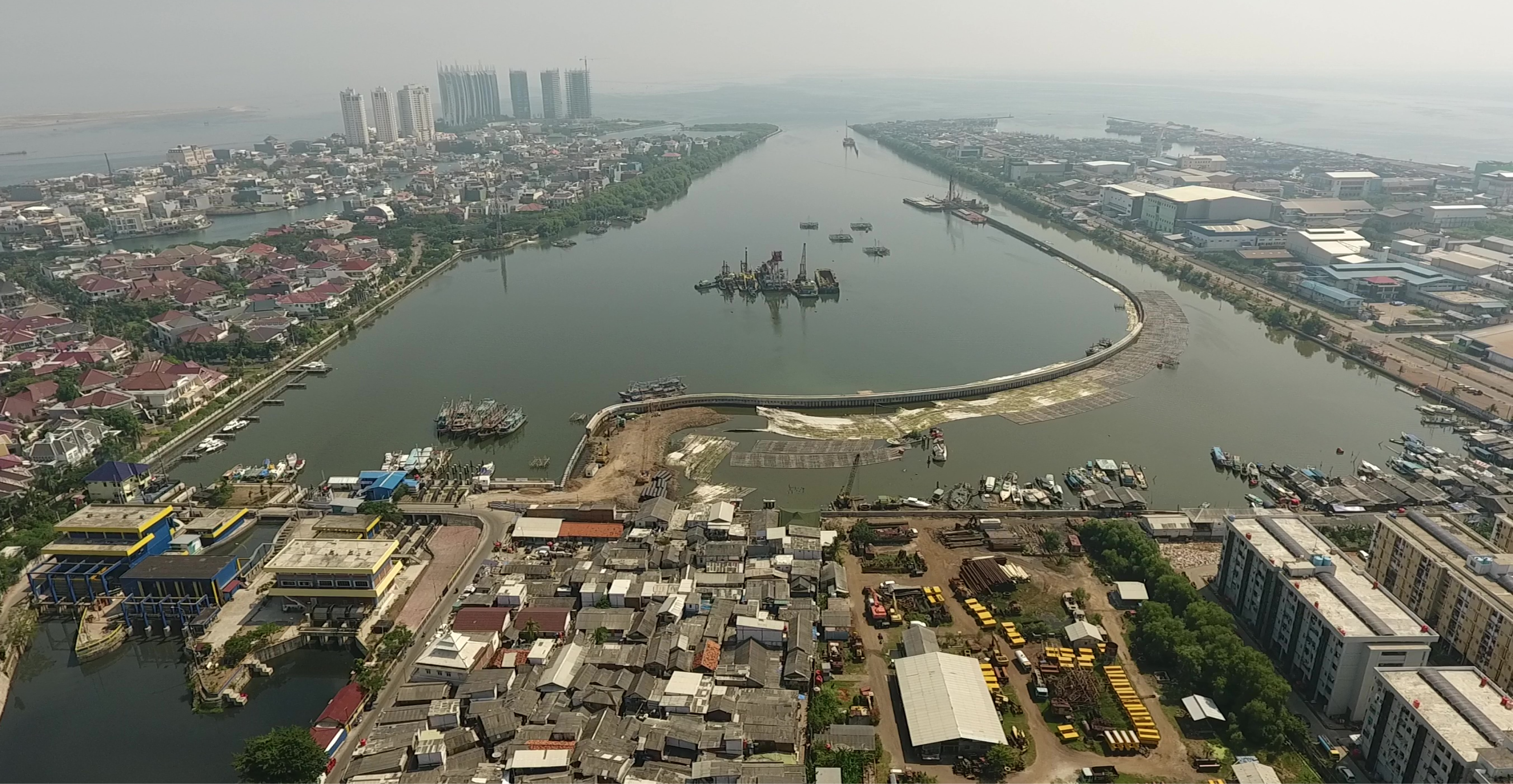 aerial shot of construction of new harbour wall in Jakarta